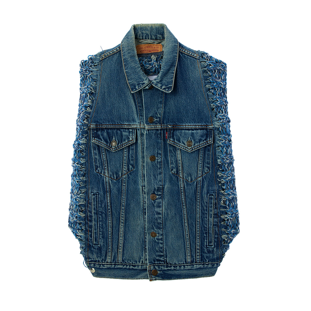 Blue denim sleeveless vest with button front, two chest pockets, and braided fringe along the sides.