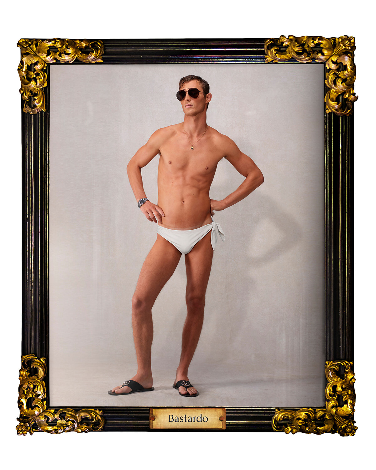 Man in white swim trunks posing with hands on hips, wearing sunglasses, inside an ornate black-and-gold frame labeled Bastardo.
