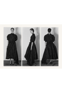 Triptych of a female model in a long black satin-style dress with puff sleeves, shown from front, side, and back.
