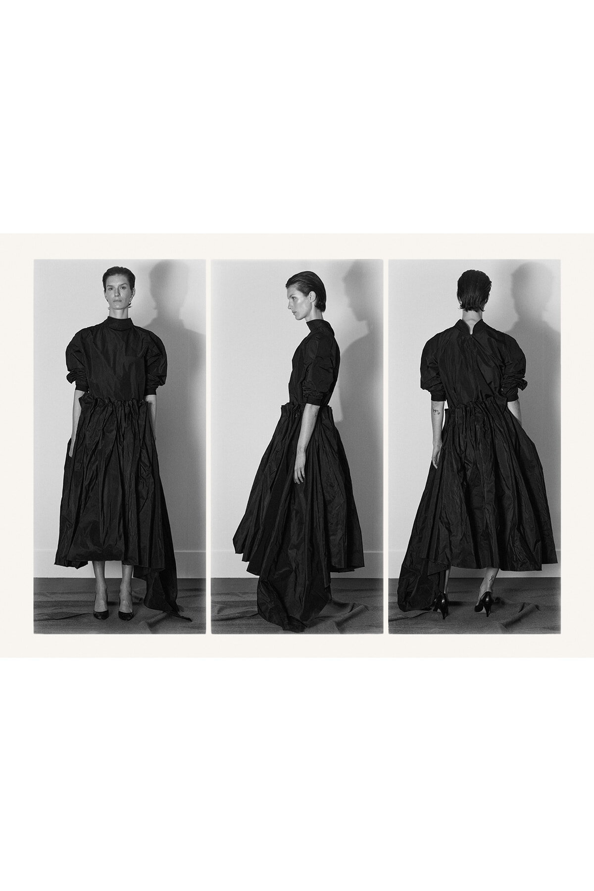 Triptych of a female model in a long black satin-style dress with puff sleeves, shown from front, side, and back.
