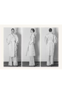 Triptych fashion image: a model in a pleated light trench and matching wide-leg pants, shown front, side, and back in black-and-white.