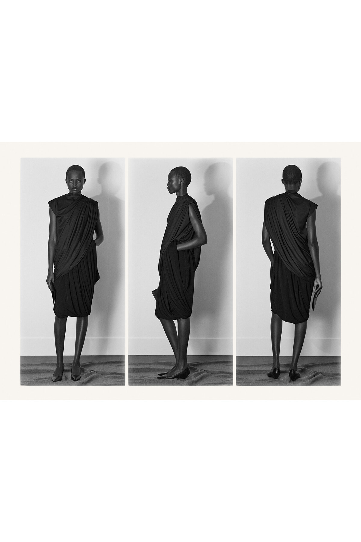 Triptych of a model in a draped black dress shown from front, side, and back against a neutral wall.
