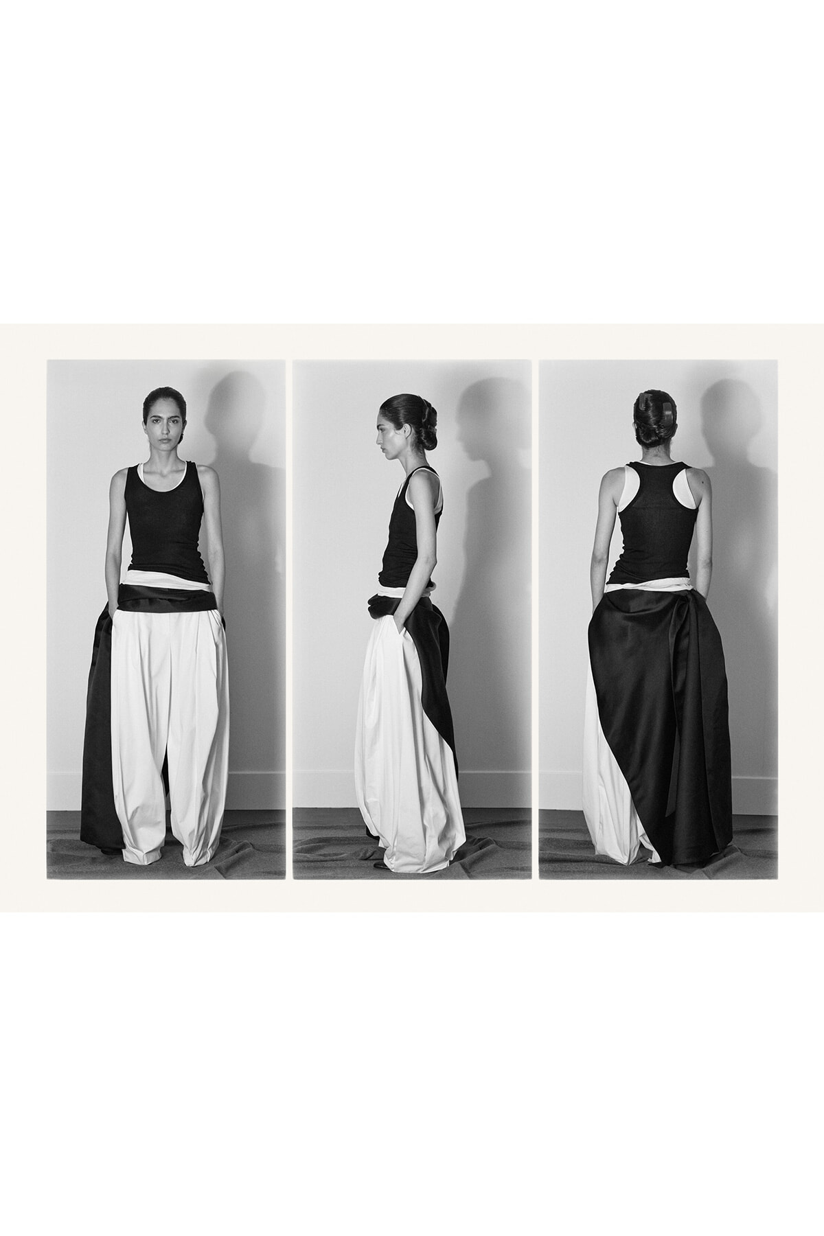 Model wears a sleeveless black top with voluminous white pants shown from front, side, and back.