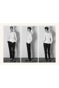 Triptych of a model in a white shirt and black trousers, shown from front, side, and back in a studio setting.