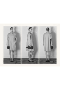 Black-and-white triptych of a woman in a knee-length trench coat shown from front, side, and back, holding a small clutch and wearing flats.
