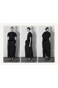 Triptych of a woman in a black blouse and long shaggy black skirt, shown from front, side, and back in black-and-white.